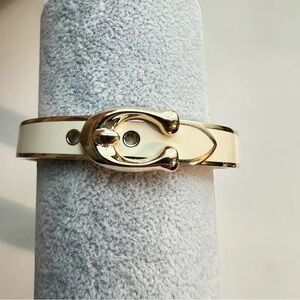 Coach Signature C Hinged Bangle Bracelet in gold-tone metal and chalk enamel